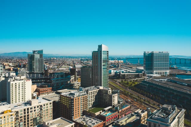 Aerial view of the downtown streets, the bridge and the skyline at East Village.