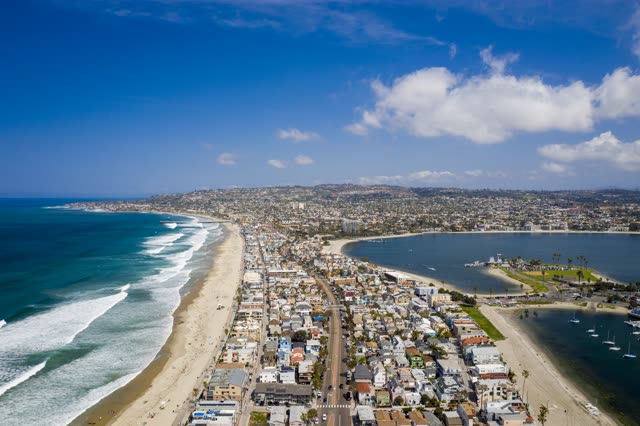 Aerial view of the beach, the surf and boats in Mission Bay.