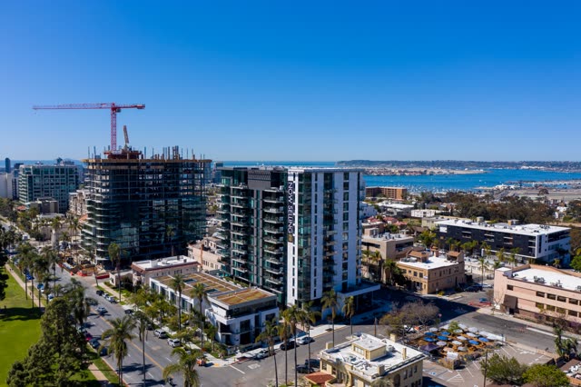 Aerial view of the downtown streets, boats and palm trees at Bankers Hill, with a work crew on site.