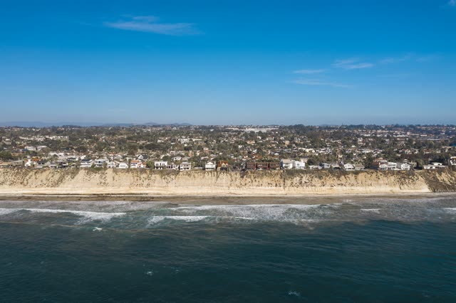 Aerial view of the cliffs, the surf and the ocean in Encinitas.