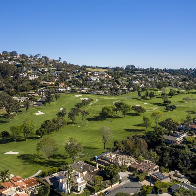 Aerial view of a residential street, homes and open country in Downtown San Diego.
