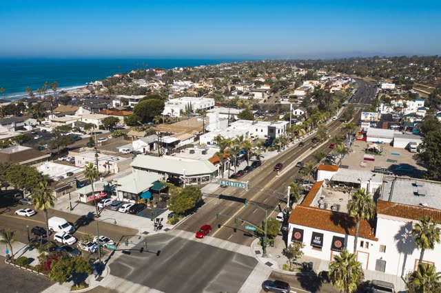 Aerial view of the downtown streets, palm trees and the ocean in Encinitas.