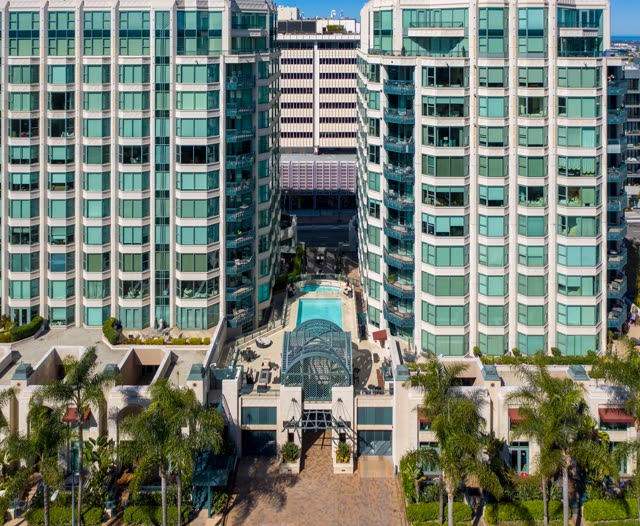 Low aerial view of the downtown streets, palm trees and the buildings at Bankers Hill.