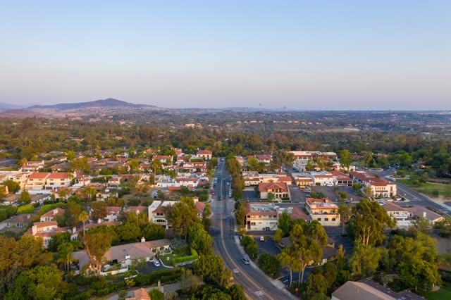 Aerial view of a residential street, homes and traffic at Covenant.