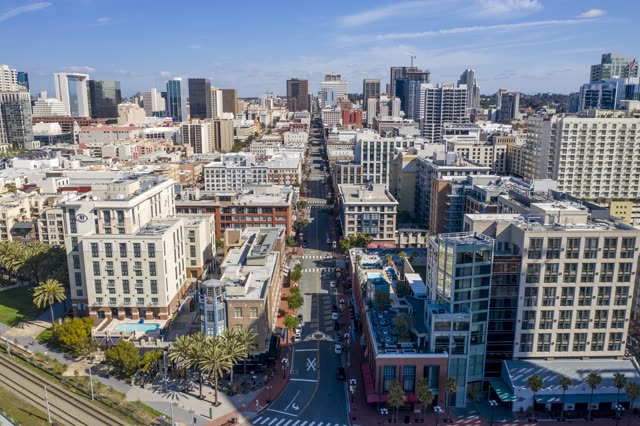 Aerial view of the downtown streets, the skyline and palm trees in Downtown San Diego.