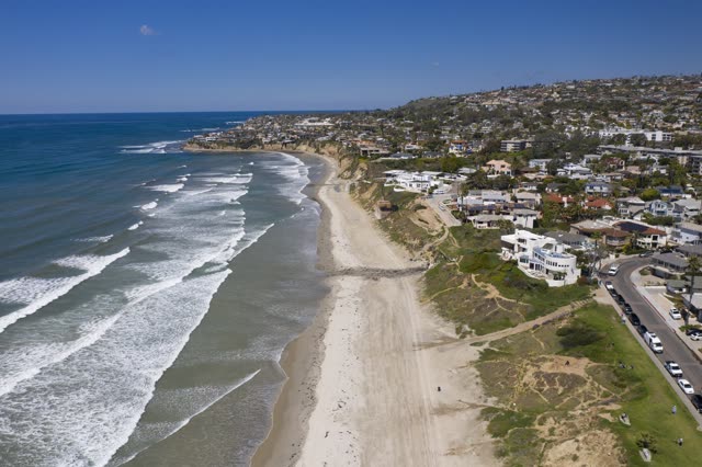 Aerial view of the cliffs, the surf and the ocean in Pacific Beach.