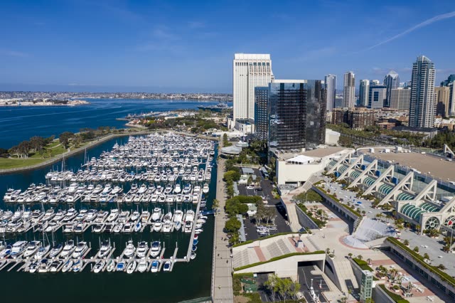 Aerial view of the harbor, the skyline and boats in Downtown San Diego, with boats out.