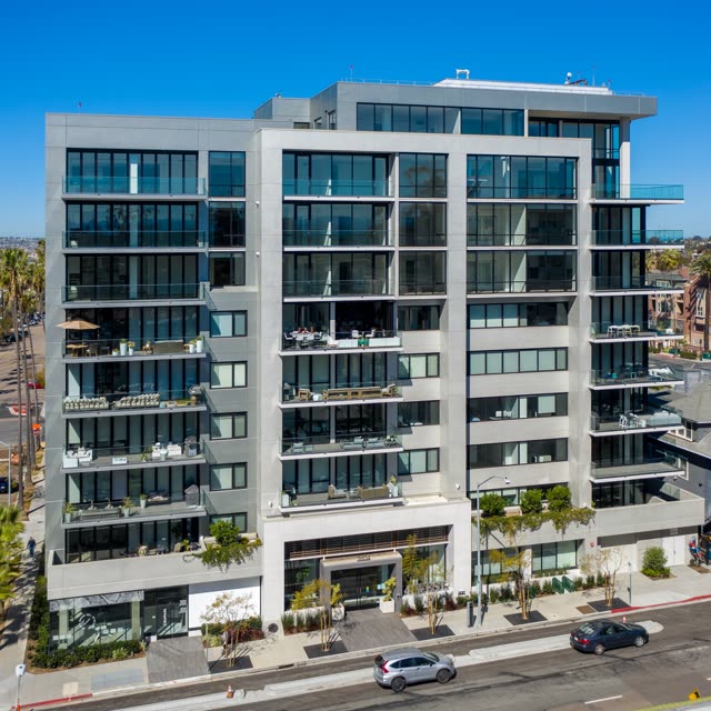 Low aerial view of the downtown streets, palm trees and the buildings at Bankers Hill.