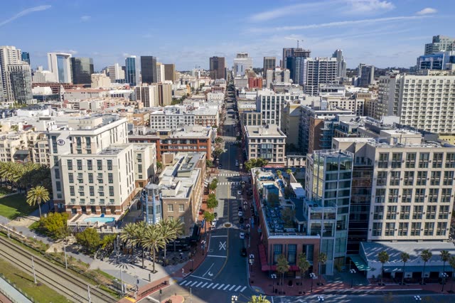 Aerial view of the downtown streets, the skyline and palm trees in Downtown San Diego.