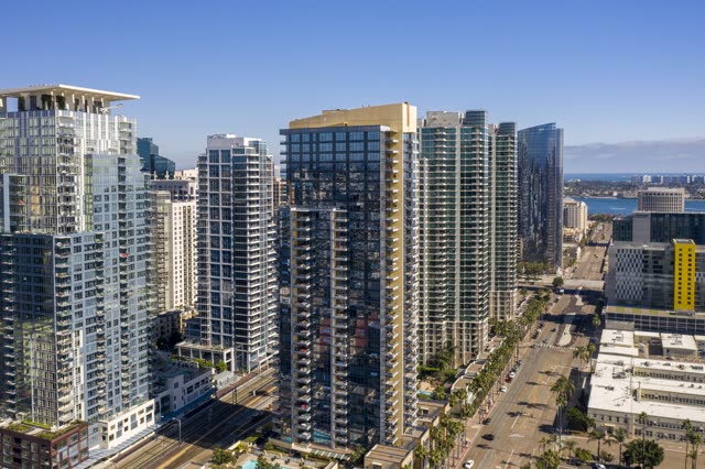 Aerial view of the downtown streets, the skyline and palm trees at Waterfront.