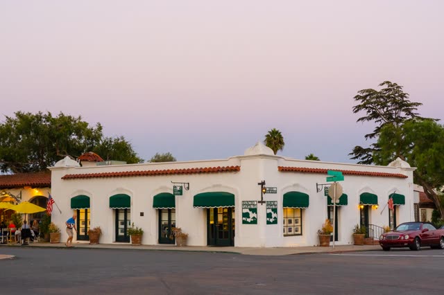The downtown streets, palm trees and homes at Covenant, with people walking.