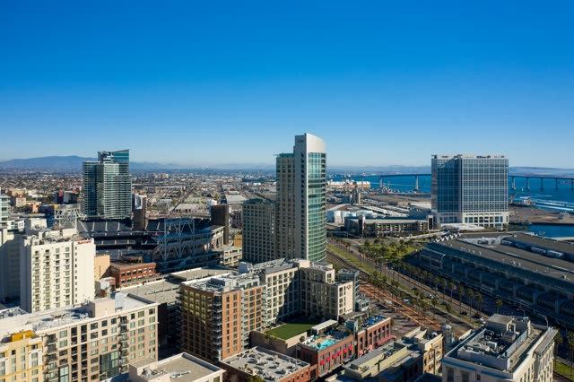 Aerial view of the downtown streets, the bridge and the skyline at East Village.