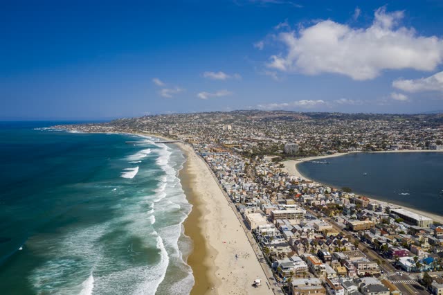 Aerial view of the beach, the surf and the ocean in Mission Bay.