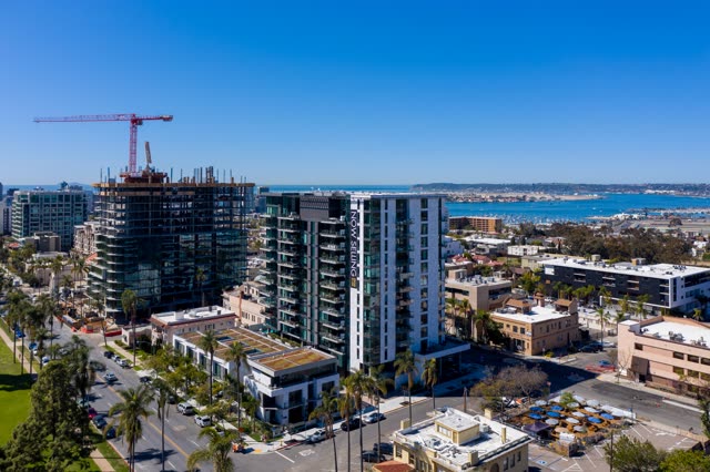 Aerial view of the downtown streets, boats and palm trees at Bankers Hill, with a work crew on site.
