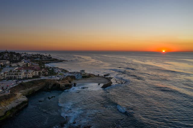 Aerial view of the cliffs, the ocean and homes at La Jolla Cove.