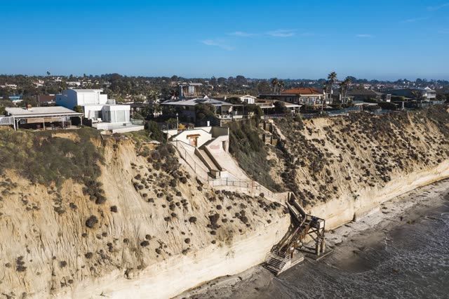 Aerial view of the cliffs, palm trees and the ocean in Encinitas.
