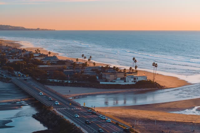Aerial view of the beach, the surf and the bridge in Del Mar.