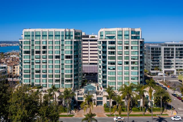 Low aerial view of the downtown streets, palm trees and the bay at Bankers Hill.