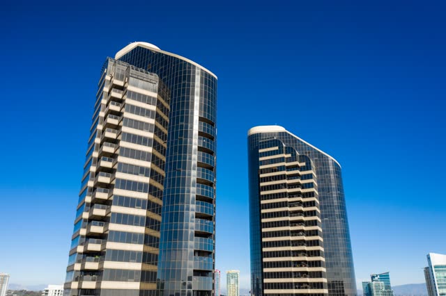 Low aerial view of the downtown streets, the skyline and the buildings at San Diego Marina.