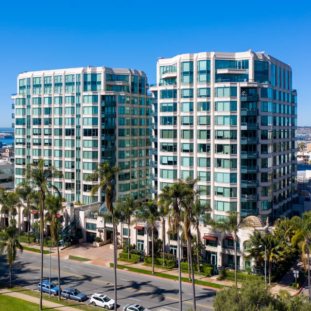 Low aerial view of the downtown streets, palm trees and the bay at Bankers Hill.