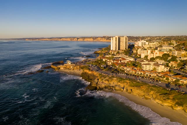 Aerial view of the cliffs, the ocean and homes at La Jolla Cove.