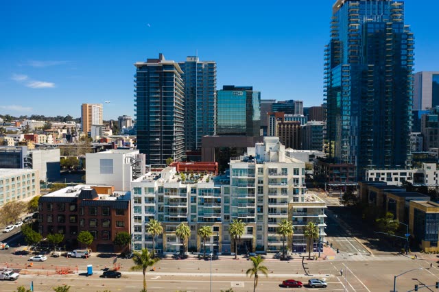Aerial view of the downtown streets, the skyline and palm trees at Waterfront.