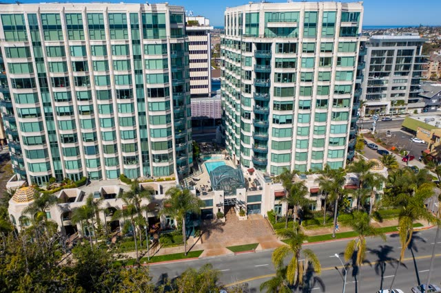 Low aerial view of the downtown streets, palm trees and the buildings at Bankers Hill.