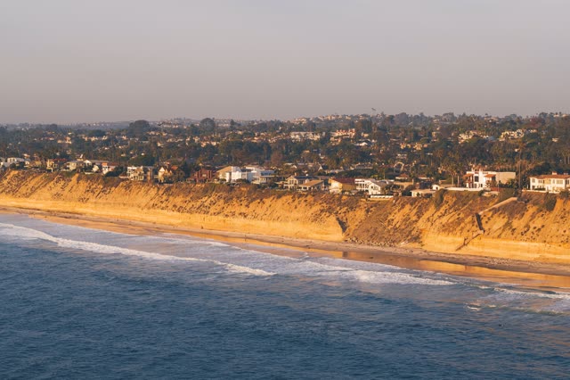 Aerial view of the cliffs, the surf and the ocean in Encinitas.