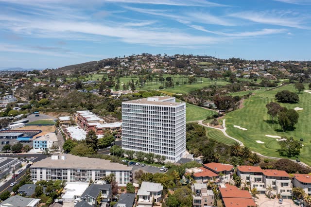 Aerial view of a residential street, homes and the buildings at La Jolla Country Club.