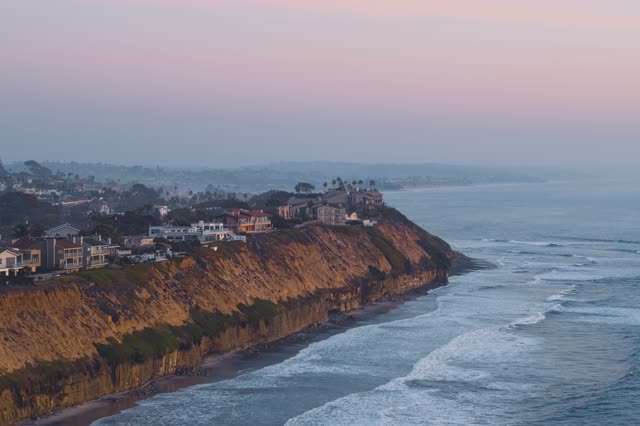 Aerial view of the cliffs, the surf and the ocean in Encinitas.