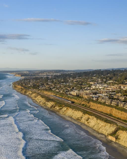 Aerial view of the cliffs, the surf and the ocean in Del Mar.