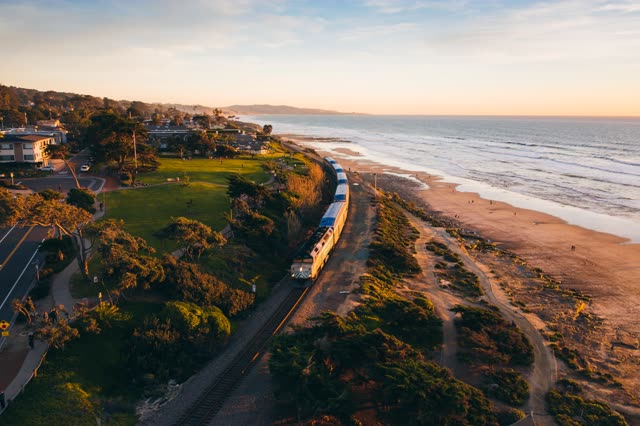 The Amtrak Pacific Surfliner on the Del Mar Bluffs during sunset | Photo