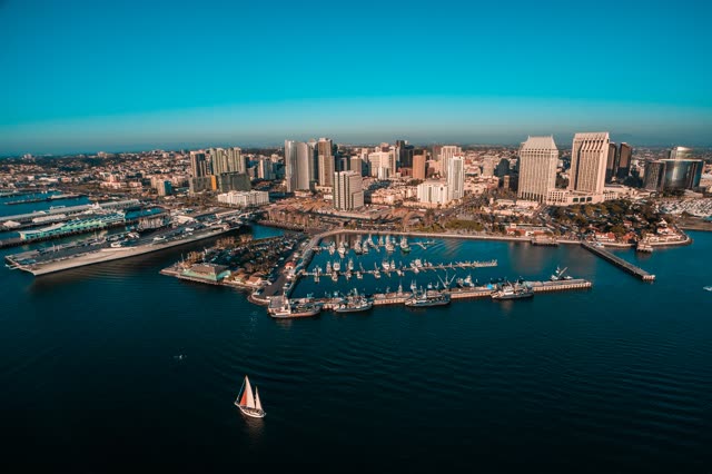 Helicopter shot over the San Diego Bay with the Manchester Grand Hyatt and other buildings in the Marina District during sunset | Photo – 4