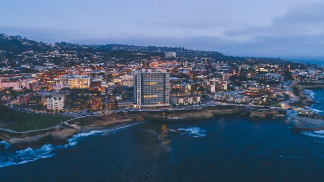 Aerial view of the cliffs, the ocean and homes at La Jolla Cove.