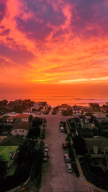 Aerial view of a residential street, palm trees and the ocean in Solana Beach.