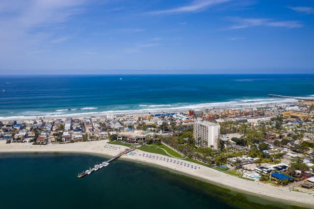 Aerial view of the beach, the surf and the pier in Mission Bay.