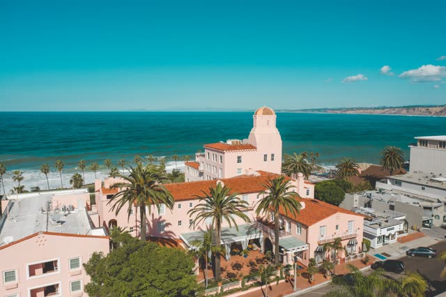 Aerial view of the downtown streets, palm trees and the ocean at La Jolla Cove.