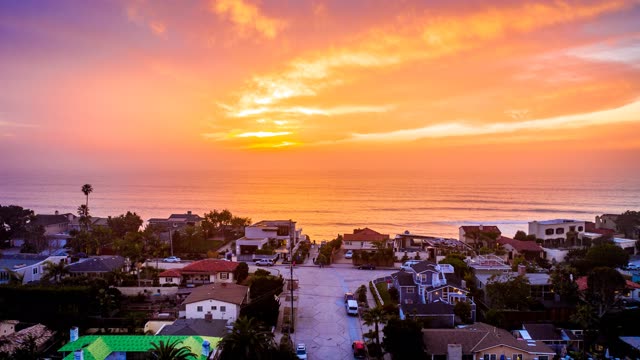 Aerial view of a residential street, palm trees and the ocean in Solana Beach.