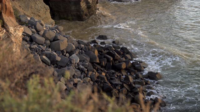 Elevated view of the cliffs, the ocean and open country at Sunset Cliffs.