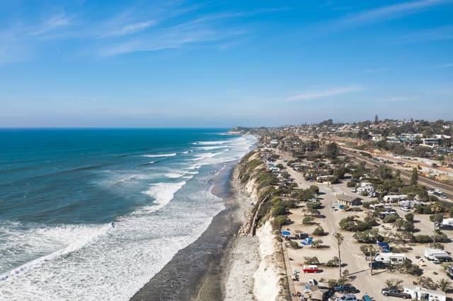 Aerial view of the cliffs, the surf and the ocean in Cardiff.