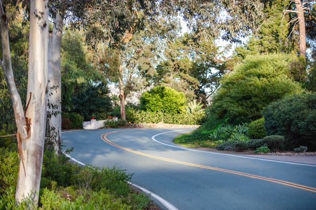 A residential street, traffic and open country at Covenant.
