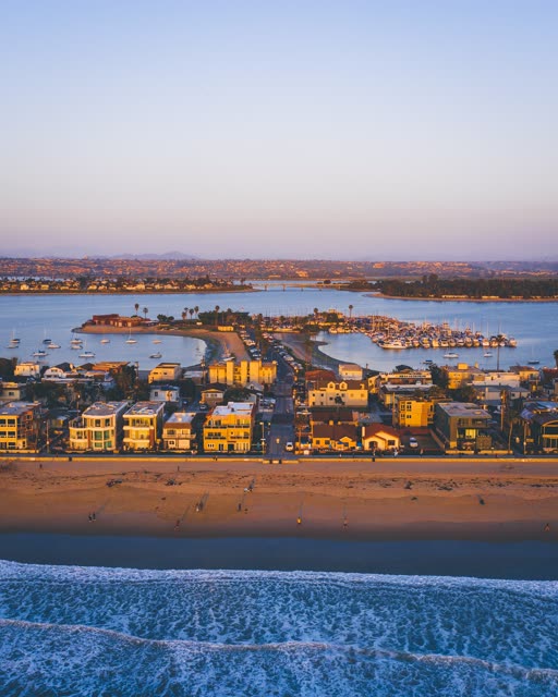 Aerial view of the beach, the surf and boats in Mission Bay.