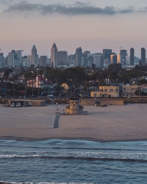 Aerial view of the beach, the skyline and the ocean at Coronado Bridge.