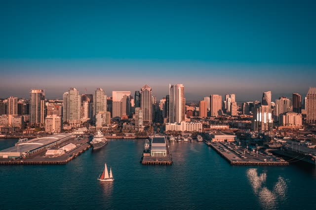 Aerial view of the harbor, the pier and the skyline at San Diego Marina, with boats out.