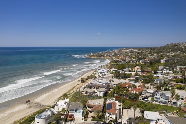 Aerial view of the beach, the surf and palm trees in Pacific Beach.