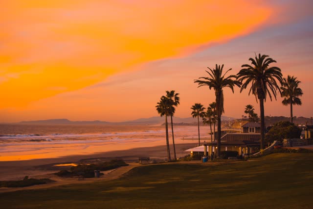 Powerhouse Park and Beach during a bright orange sunset | Photo – 4