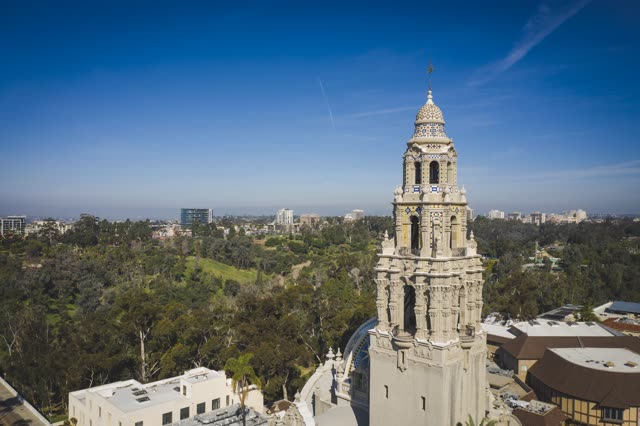 Low aerial view of a park, the buildings and the city in Balboa Park.