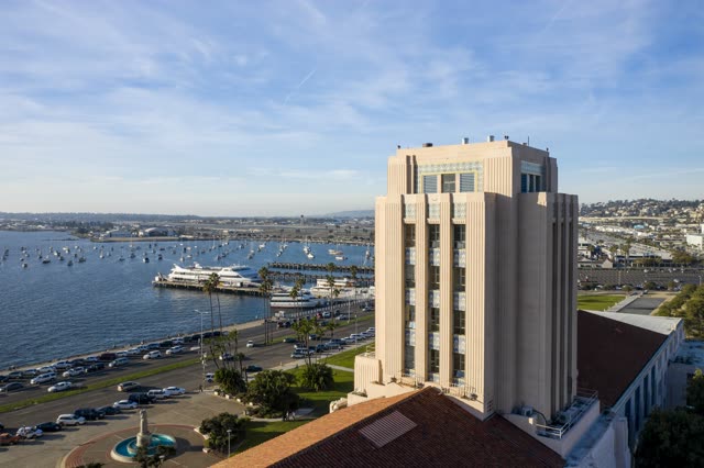 Low aerial view of the harbor, the pier and boats at Waterfront.