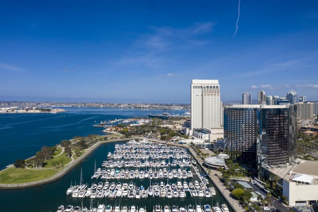Aerial view of the harbor, the skyline and boats in Downtown San Diego, with boats out.