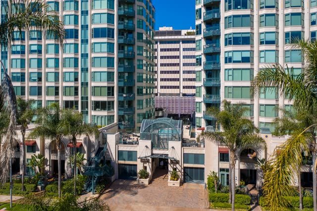 Low aerial view of the downtown streets, palm trees and the buildings at Bankers Hill.